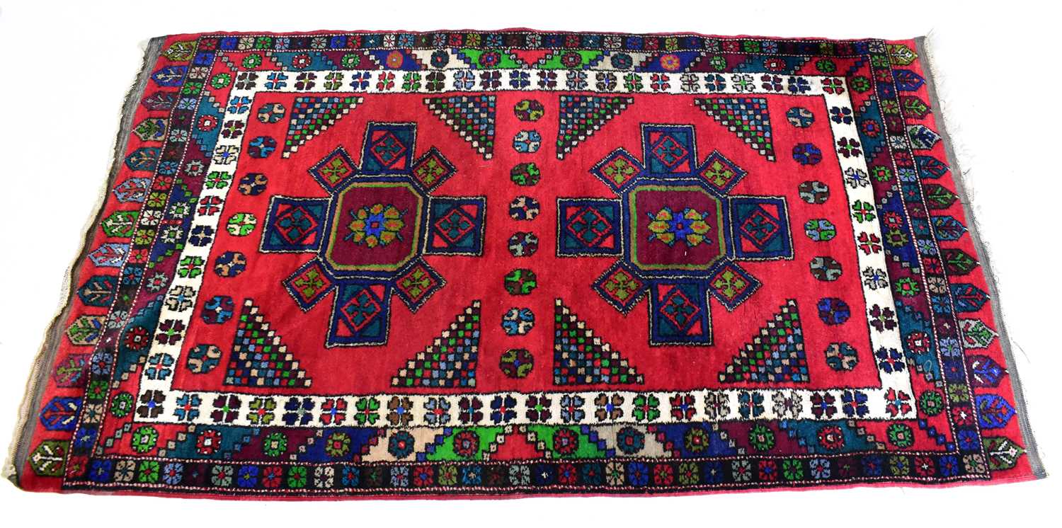 Lot 143 - A Turkish hand-knotted rug in blue, white,...