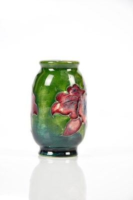 Lot 1283 - WALTER MOORCROFT; a miniature vase in the...