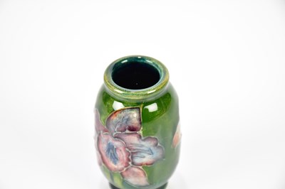 Lot 1283 - WALTER MOORCROFT; a miniature vase in the...