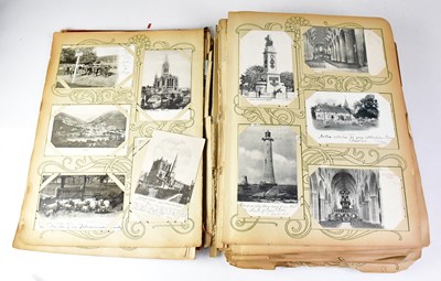 Lot 551 - A postcard album containing black and white...