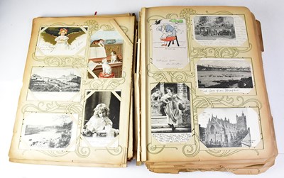 Lot 551 - A postcard album containing black and white...