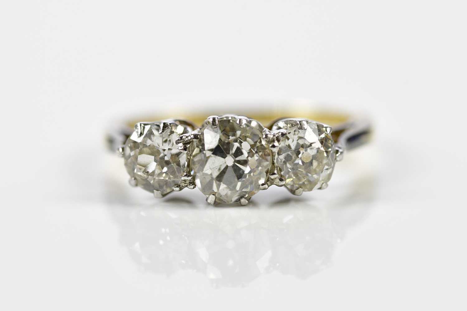 Lot 67 - A yellow and white metal graduated three