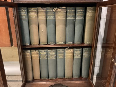 Lot 34 - A 1920s oak display cabinet with pair of...