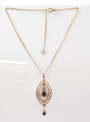 Lot 790 - An Edwardian 9ct gold pendant of open oval...