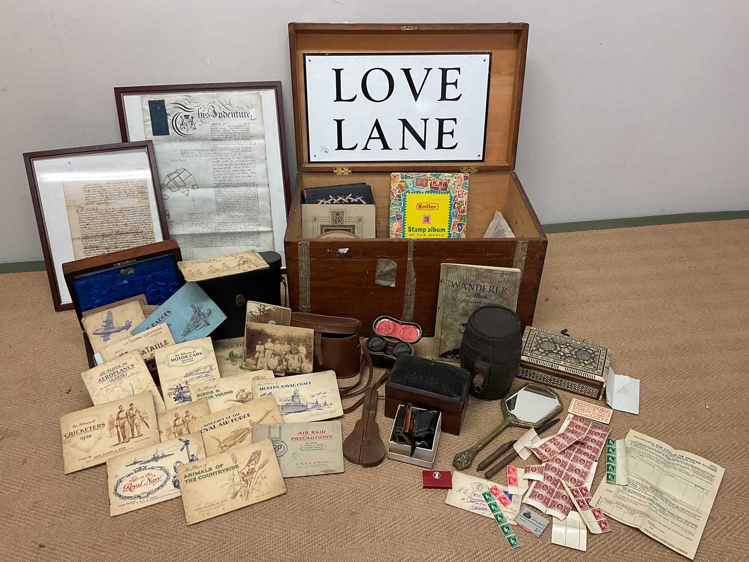 Lot 23 - A wooden trunk of collectors' items, to...