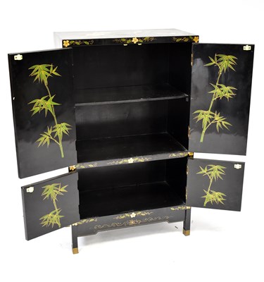 Lot 10 - A 20th century black lacquered cabinet...