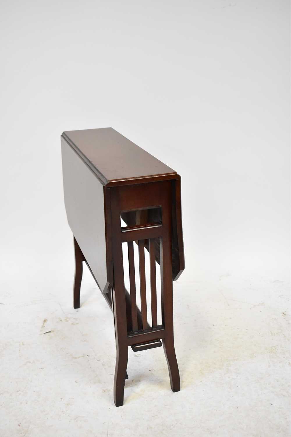 Lot 16 - An Edwardian mahogany Sutherland table with...