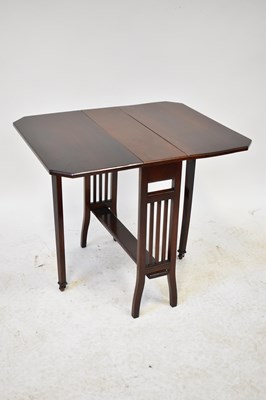 Lot 16 - An Edwardian mahogany Sutherland table with...