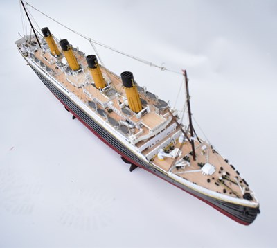Lot 252 - RMS TITANIC; a wooden model with four funnels...