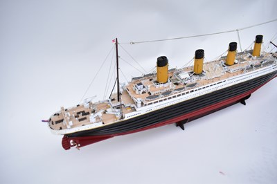 Lot 252 - RMS TITANIC; a wooden model with four funnels...