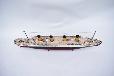 Lot 252 - RMS TITANIC; a wooden model with four funnels...
