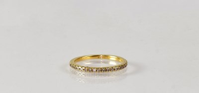 Lot 833 - An 18ct yellow gold half eternity ring set...